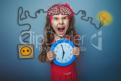 Teenage girl holding a clock and cries of rage charging cord plu