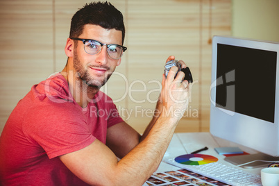 Handsome hipster working at desk