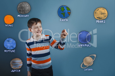 Teenage boy laughing and holding a finger of the planet of the s