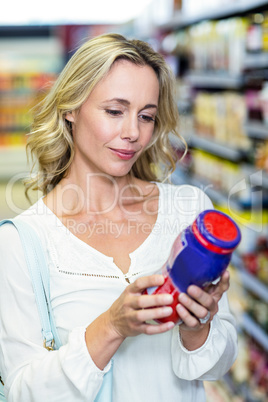 Woman reading nutritional values