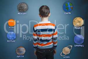 teenager boy turned his back on the planets of the solar system