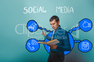 man frowning businessman reading a book pointing to social media
