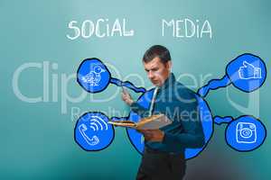 man frowning businessman reading a book pointing to social media