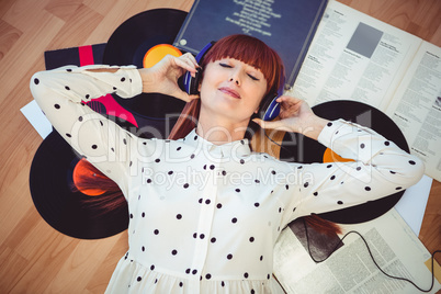 Hipster woman with closed eyes and headphones