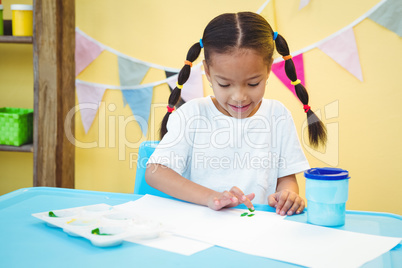 Girl using her fingers to paint