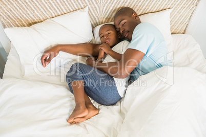 Father and son sleeping together