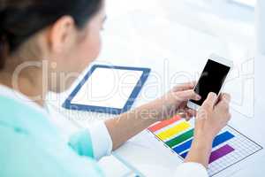 Businesswoman using her smart phone