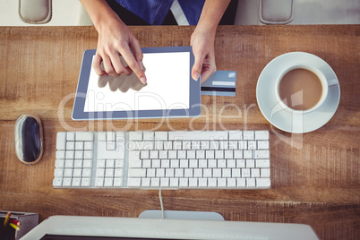 Cropped image of woman using tablet