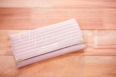 Close up view of a pink wallet