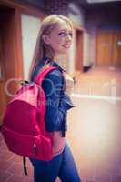 Pretty student with backpack looking at the camera