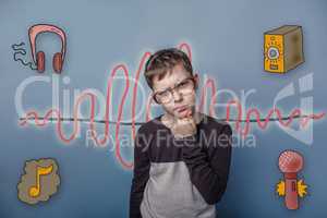 Teenage boy in glasses propped his chin with his fist thought se