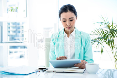 Businesswoman using her tablet pc