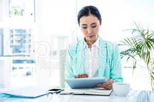 Businesswoman using her tablet pc