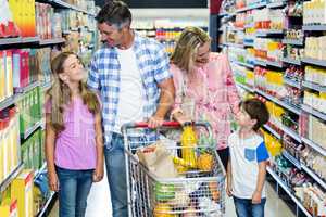 Happy family at the supermarket