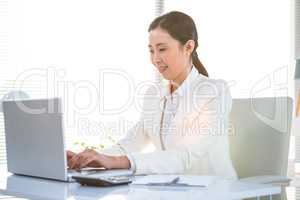 Businesswoman using her laptop