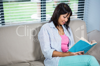 Casual happy woman reading book