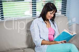 Casual happy woman reading book