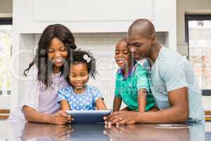 Happy family using tablet