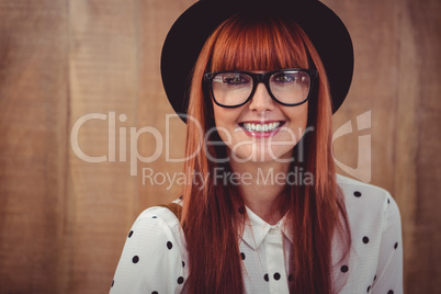 Smiling hipster woman posing face to the camera