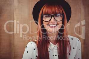 Smiling hipster woman posing face to the camera