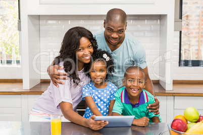 Happy family using tablet