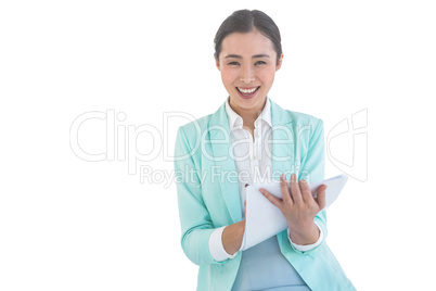 Smiling businesswoman holding notes