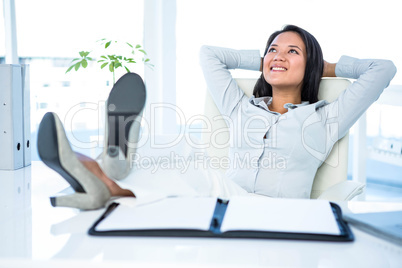 Smiling businesswoman relaxing herself