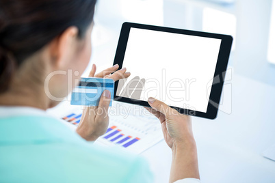 Businesswoman using her tablet pc