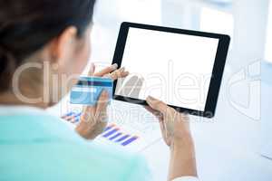 Businesswoman using her tablet pc