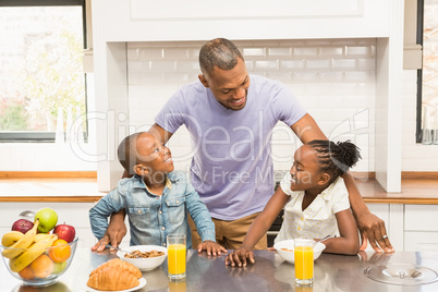 Casual happy family having breakfast