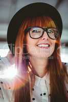 Attractive smiling hipster woman with hat