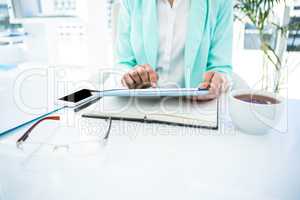 Businesswoman using her tablet pc