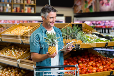 Smiling man looking at his list