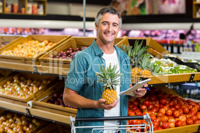 Smiling man looking at his list