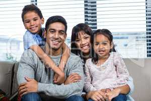 Smiling family on the sofa