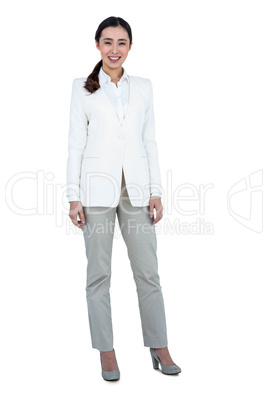 Smiling businesswoman standing straight up