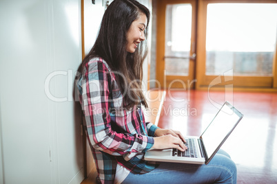 Smiling student sitting at the computer