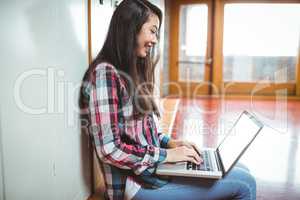 Smiling student sitting at the computer