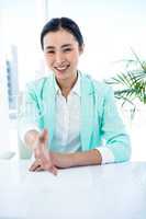 Smiling businesswoman offering a handshake