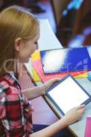 Blonde student using tablet during class