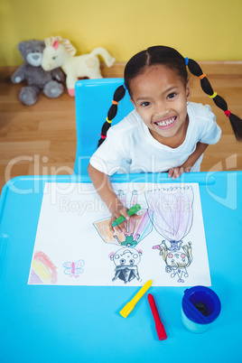 Smiling girl with her coloruing book