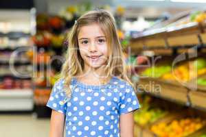 Smiling young girl looking at camera