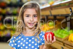 Cute girl holding an apple