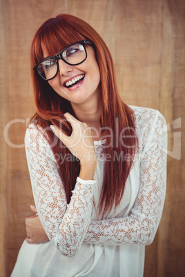 Smiling hipster woman posing face to the camera