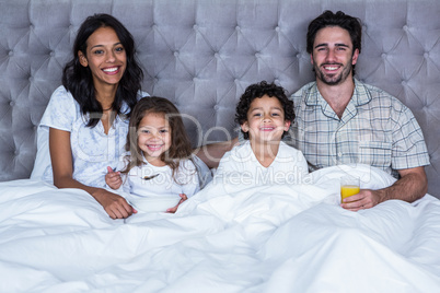 Happy family posing for camera