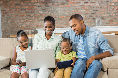 Happy family using technology together