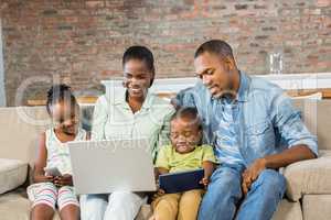 Happy family using technology together