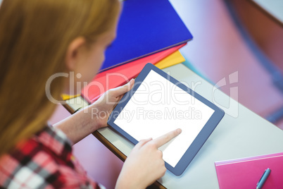 Blonde student using tablet during class