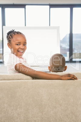 Two children sitting on sofa