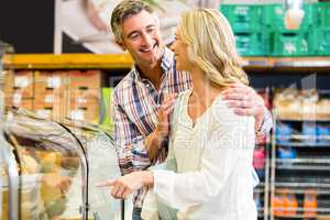 Happy couple buying food